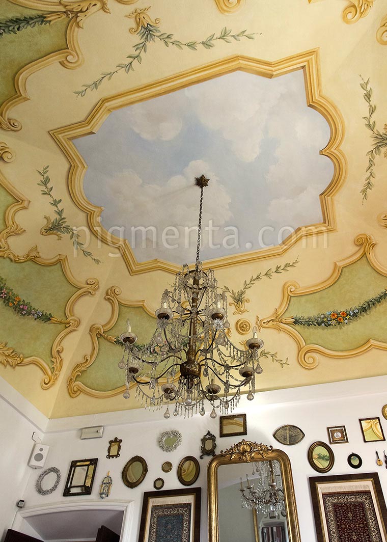 ceiling painted with sky and reliefs